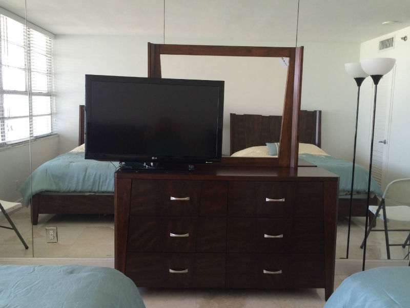 bedroom mirror and TV