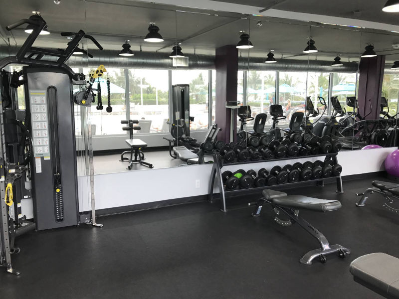 gym with weights and mirror