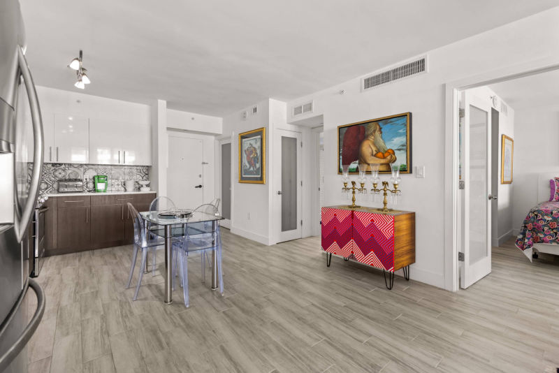 dining room with entrance to bedroom