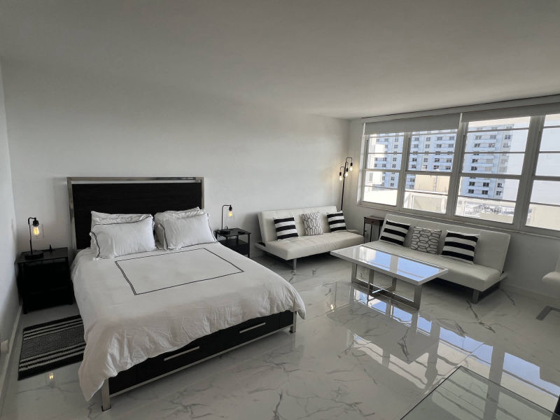 living room with bed in forground