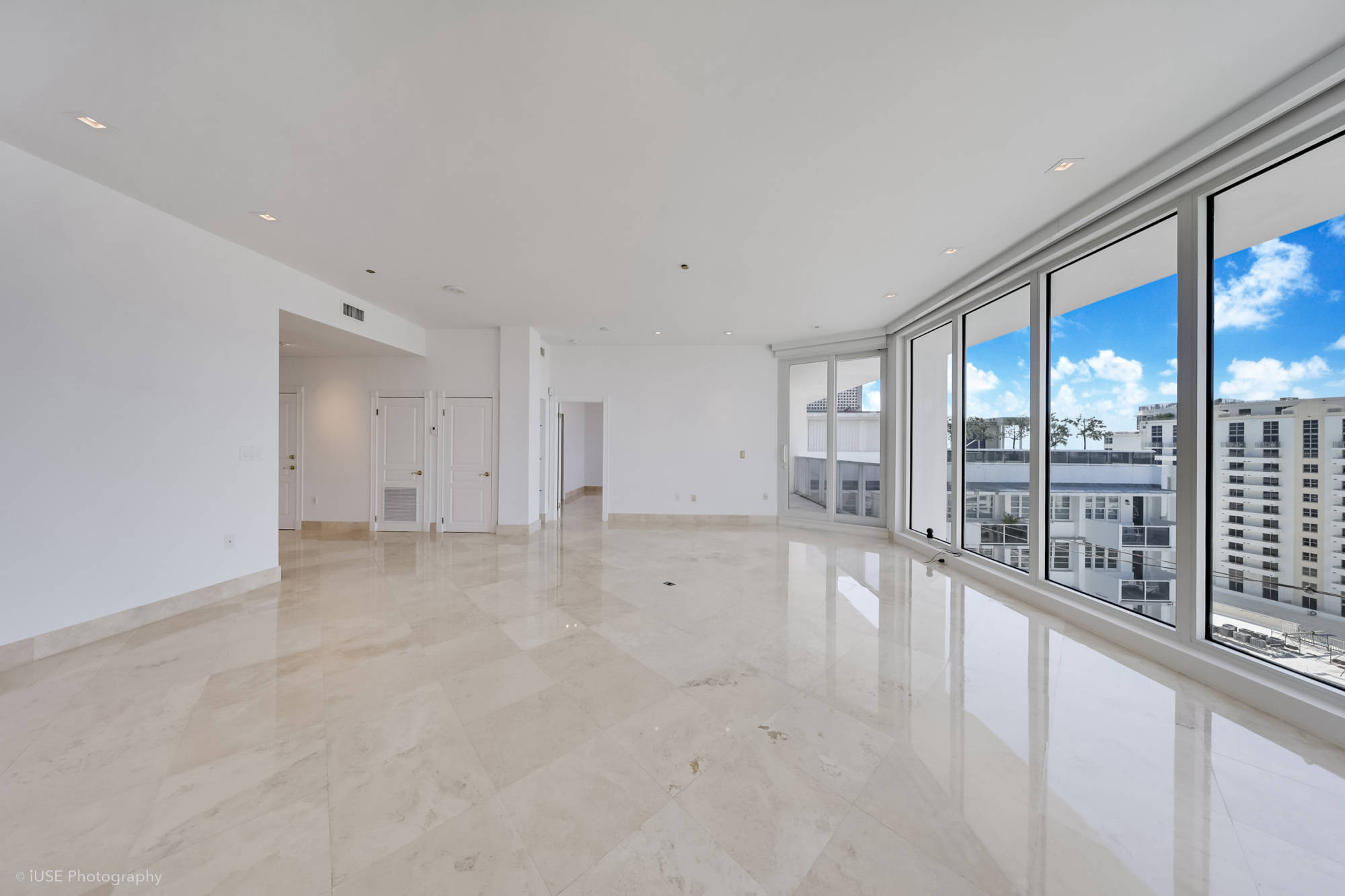 living room with view of other penthouse
